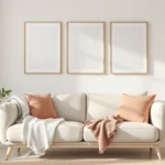 College apartment decor in a small rental living corner: an oatmeal sofa, a trio of framed prints, a brass lamp, and a jute rug.